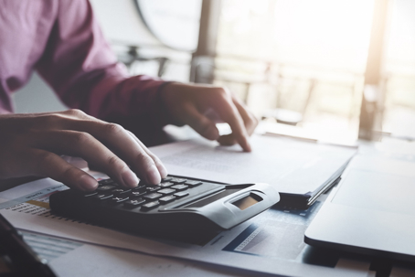 person calculating budget